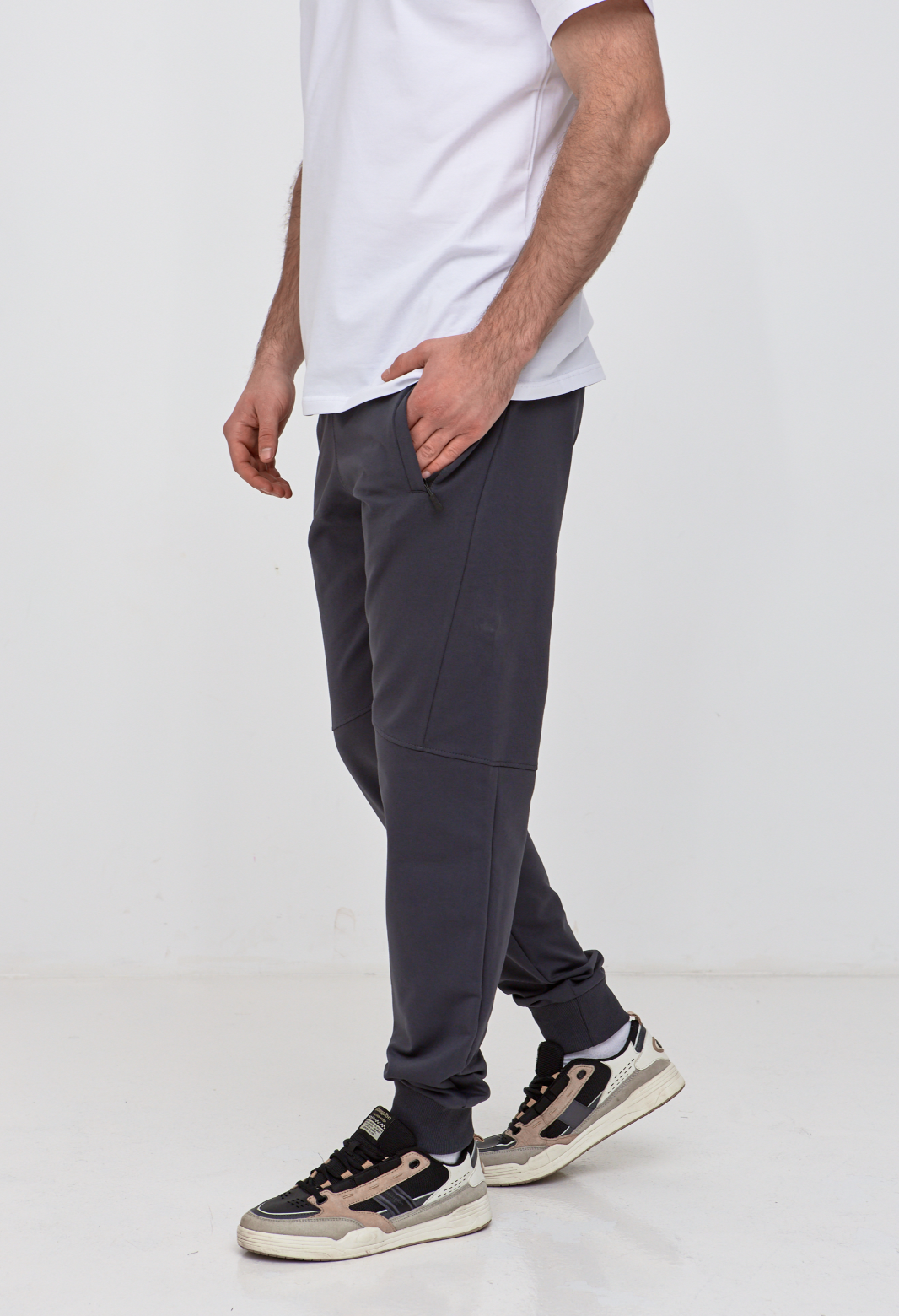 Брюки "резанные" на манжетах с карманами на застежке 19000